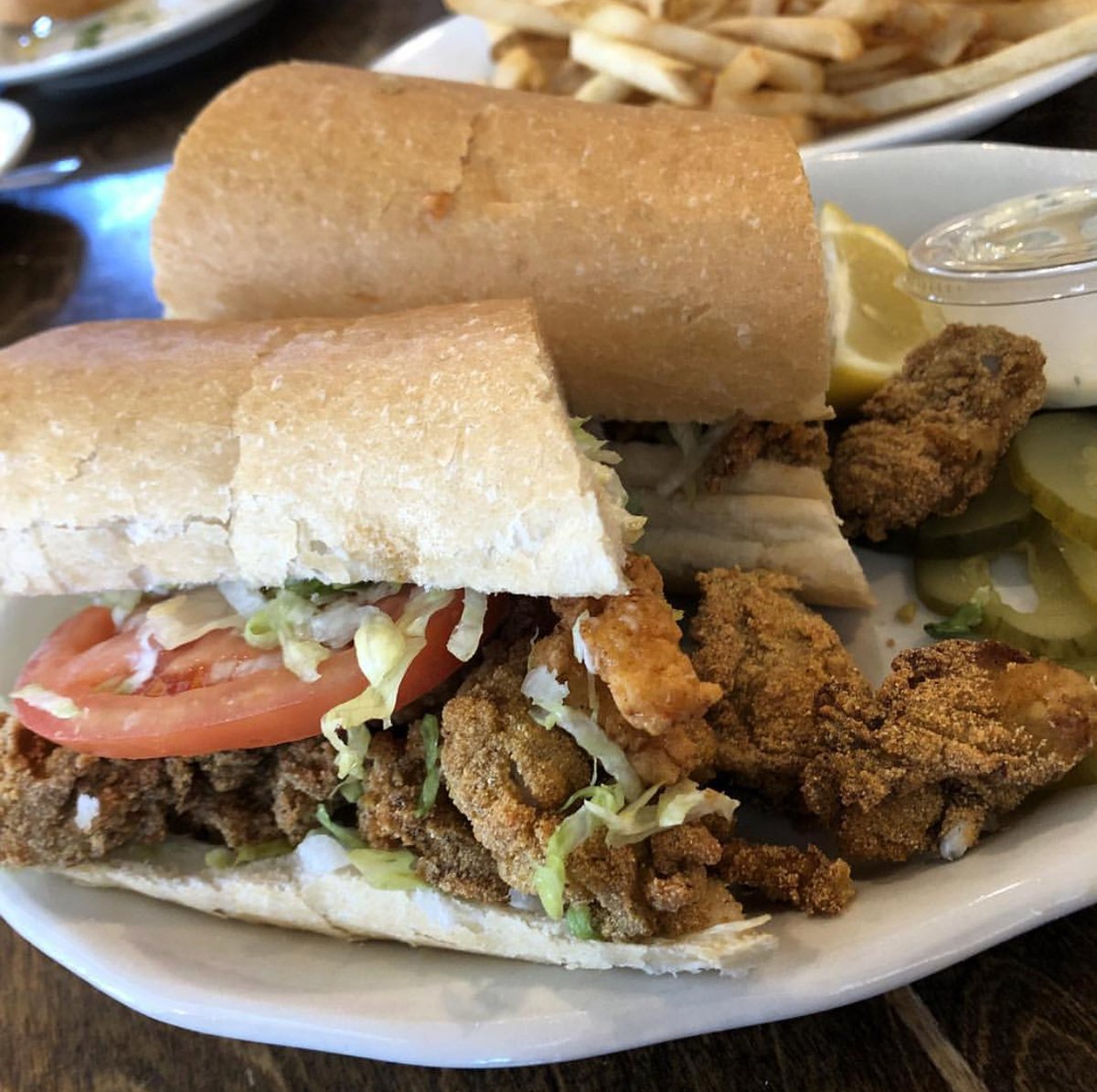 A Mandina's #PoBoy is sure to put a smile on your face whether you're a fan of #oysters or #shrimp or both!

#Mandinas #NewOrleans #NOLAdining #NOLAeats
