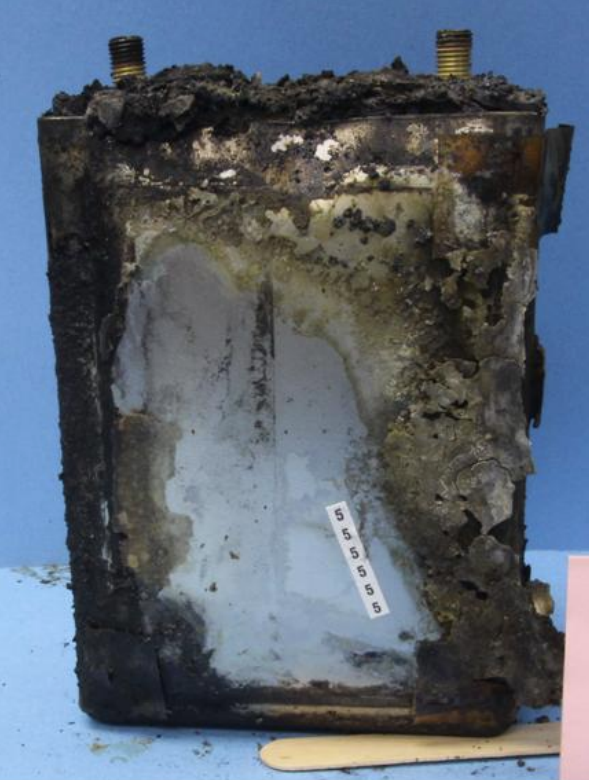 although nearly all the cells had caught fire and failed due to thermal runaway, there were two cells (#5 and #6) that looked like they may have failed first, causing the fire that then caused the other cells to fail as well. here's cell #5.