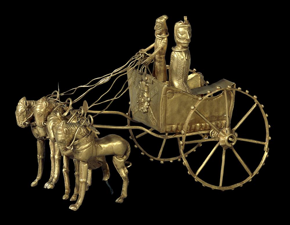 26. Oxus Chariot ModelDetails on this Persian figure are invisible to us-The passenger wears a stylish, expensive overcoat-The relief on the front of the chariot is an Egyptian God, Bes-They're wearing clothes from NW Iran, but the figure was found in NE Afghanistan