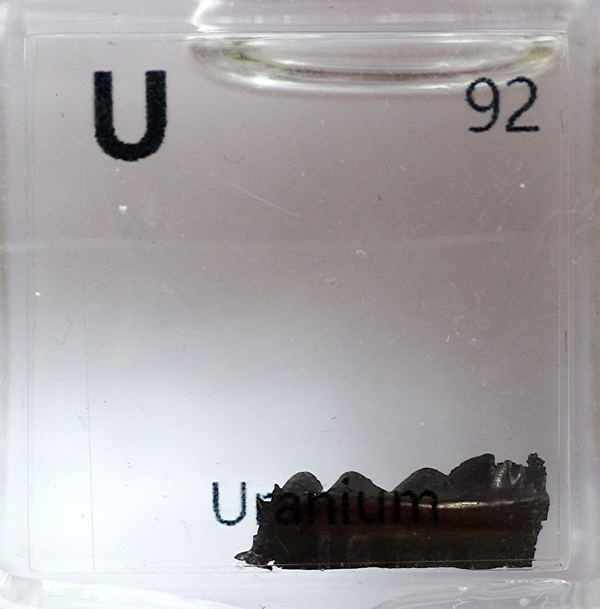 Uranium  #elementphotos. Yellow powder is uranyl acetate (UO2(O2CCH3)2.2H2O). Green glass contains uranium salts doped into the glass to make it fluoresce in UV light.