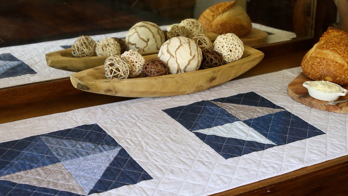 Benartex's tweet photo. Classic scrappy blocks create a simple yet stunning table runner. Solitaire designed by Emily Tindall (Homemade Emily Jane) features the beautiful blues of the Winter Wool collection by Cheryl Haynes. Find the pattern in Issue #15 of Modern by the Yard. https://t.co/Xh3XSAx5kY https://t.co/UIL1BTL5rA
