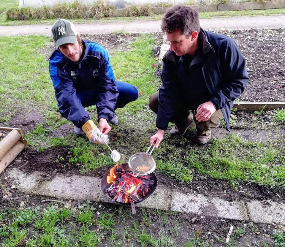 Toasting marshmallows on an open fire