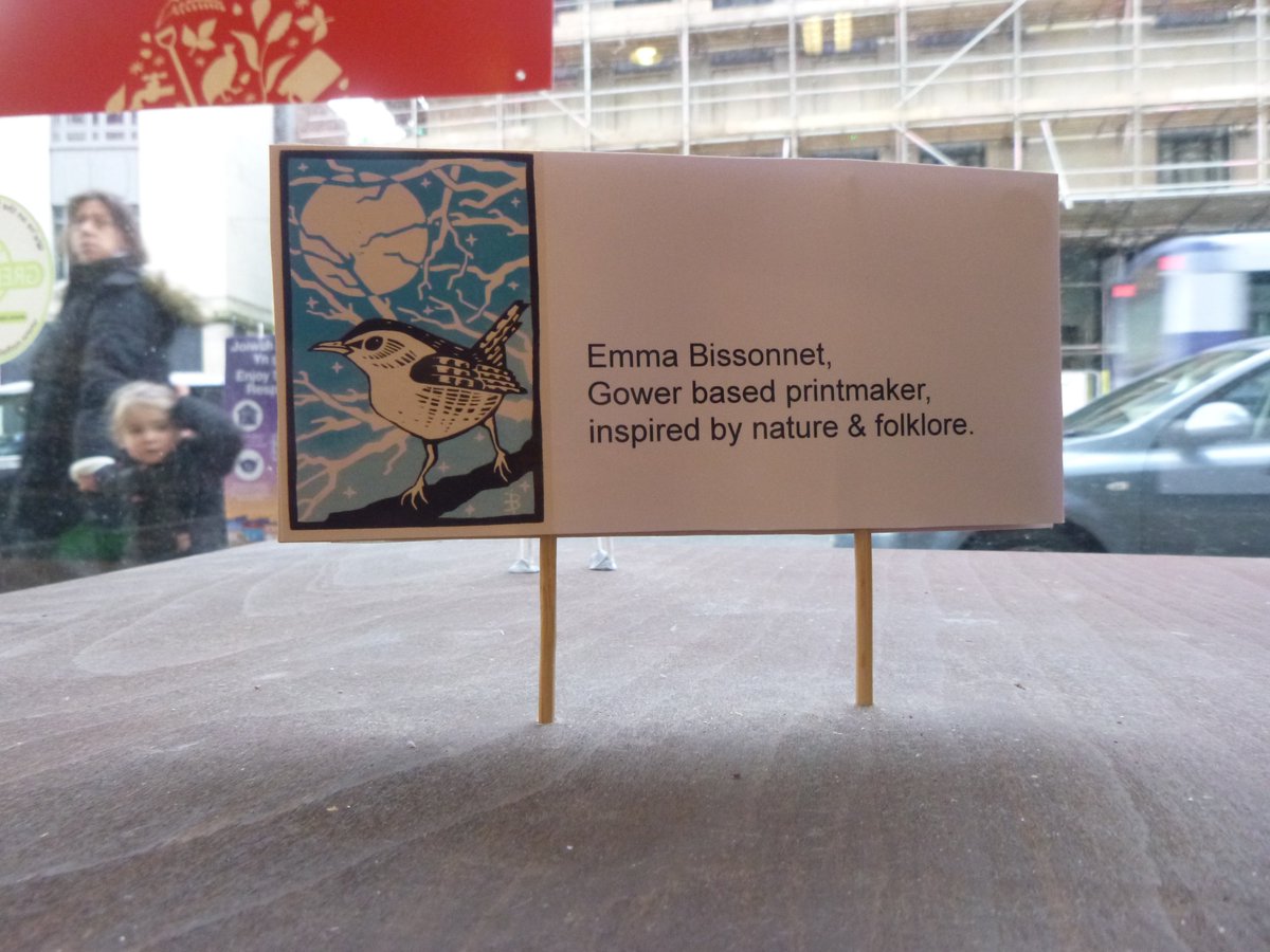 OxfamCastleSt's tweet photo. Setting up @EmmaBissonnet's #Winter #Christmas exhibition of her beautiful #linocuts in the #NGOCAW mini gallery in our #Oxfam shop window. @StephMastoris' equally beautiful #letterpress prints are still on show in the upper gallery. #FoundInOxfam #Swansea https://t.co/gIV1bwjcY3