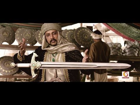 Johnny as Aslaam Khan - the one who brings weapon during war