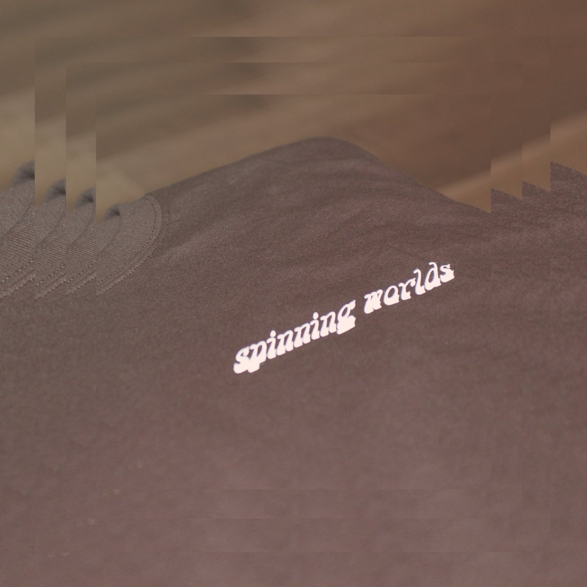 ACGoldie9's tweet photo. “Spinning Worlds” merch is available now. DM if you’d be interested in a shirt 🖤🖤 https://t.co/d4X8pxvRxT