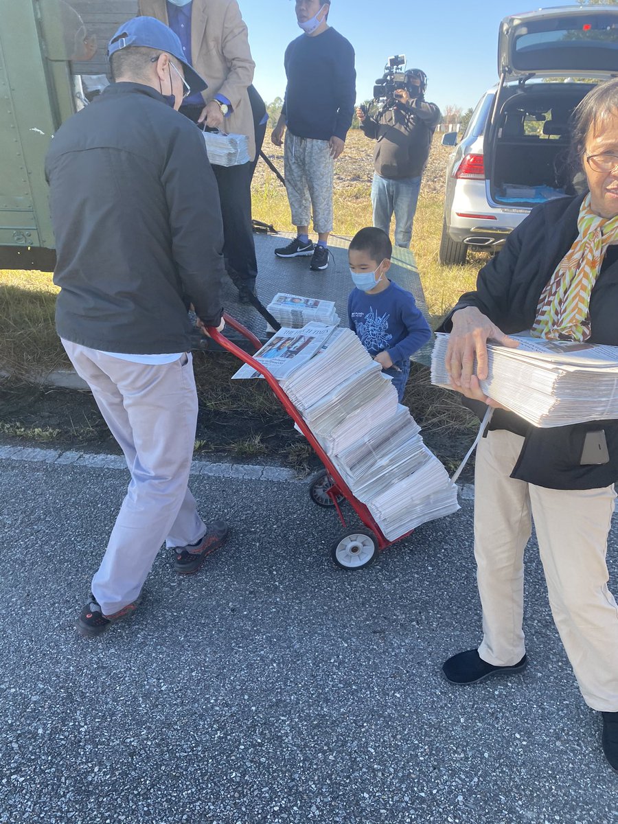 donie's tweet photo. Huge Epoch Times push outside tonightโs Trump rally in Georgia. A copy being left on every car. https://t.co/qxqXKCw87e