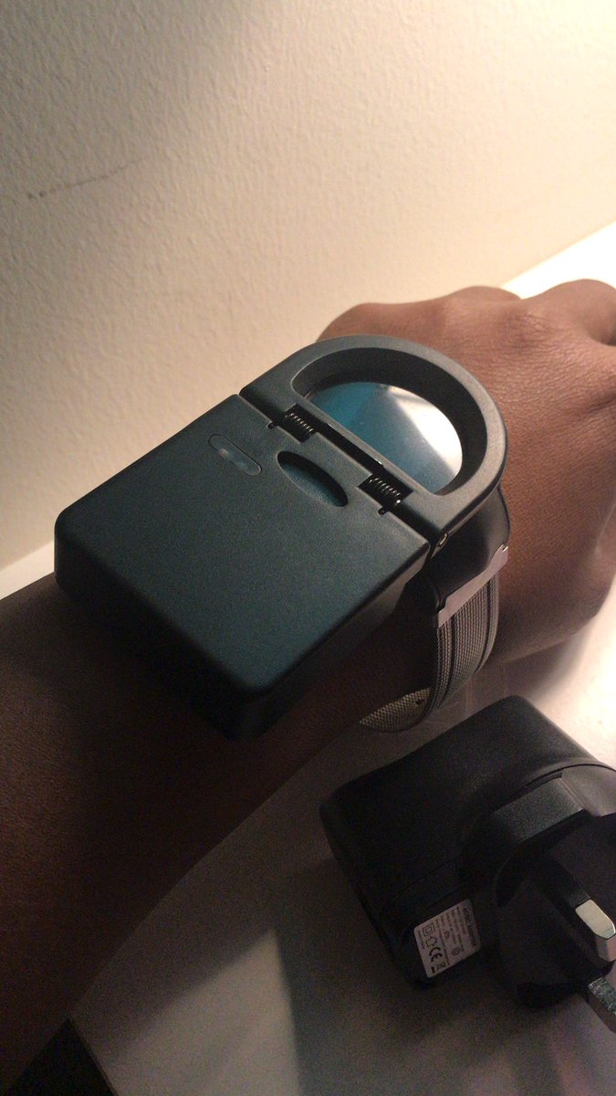Abu Dhabi requires a 14 day self-quarantine while wearing a tracking device. Here is a photo of my watch with the charger on it. The actual watch is smart watch size. Looks like a Samsung fitness watch. Waterproof and fitted loosely for my comfort.