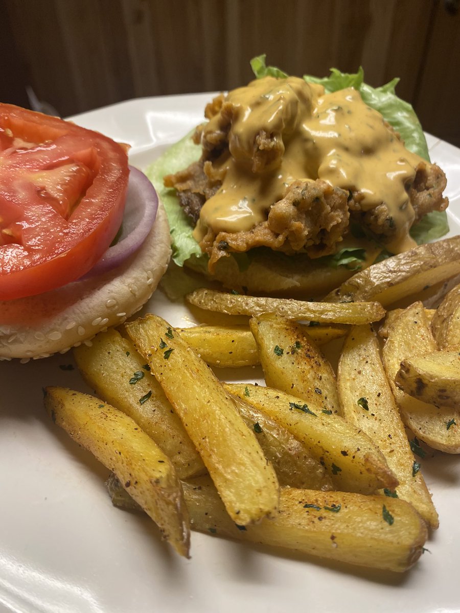 Fried oyster mushrooms sandwich with fries