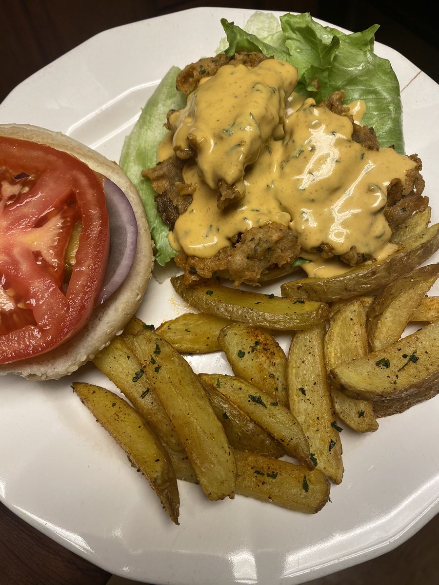 Fried oyster mushrooms sandwich with fries