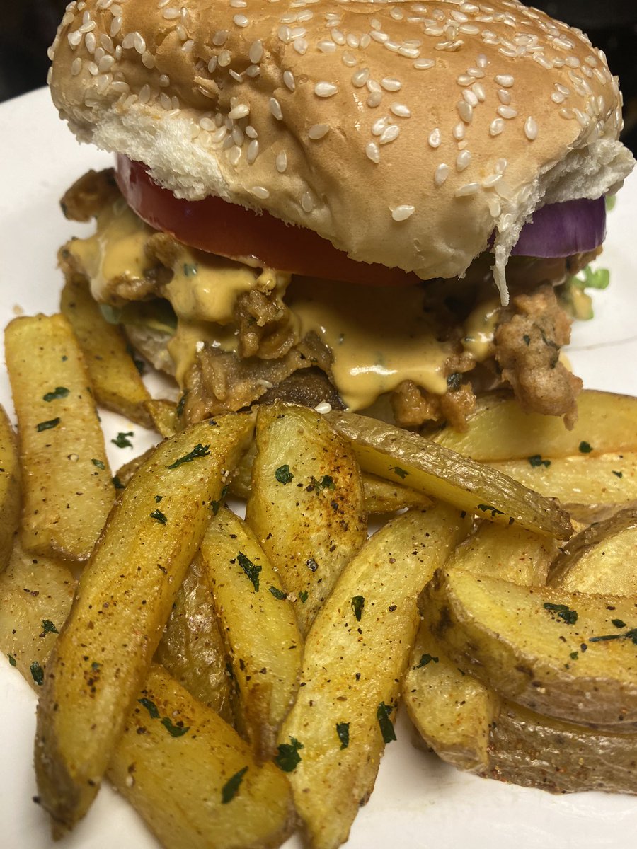 Fried oyster mushrooms sandwich with fries