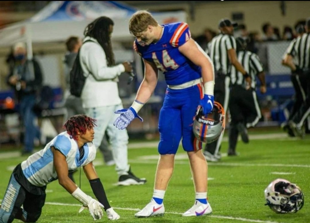 Tremendous sportsmanship shown by Jacksonville, Fla. Bolles H.S. outstanding LB Jack Pyburn towards Gadsden County H.S. star CB Zaire Riley during the FHSAA 4A semifinal game. Gadsden County H.S. and Bolles H.S. played a very hard fought game won by Bolles in overtime 10 - 7.