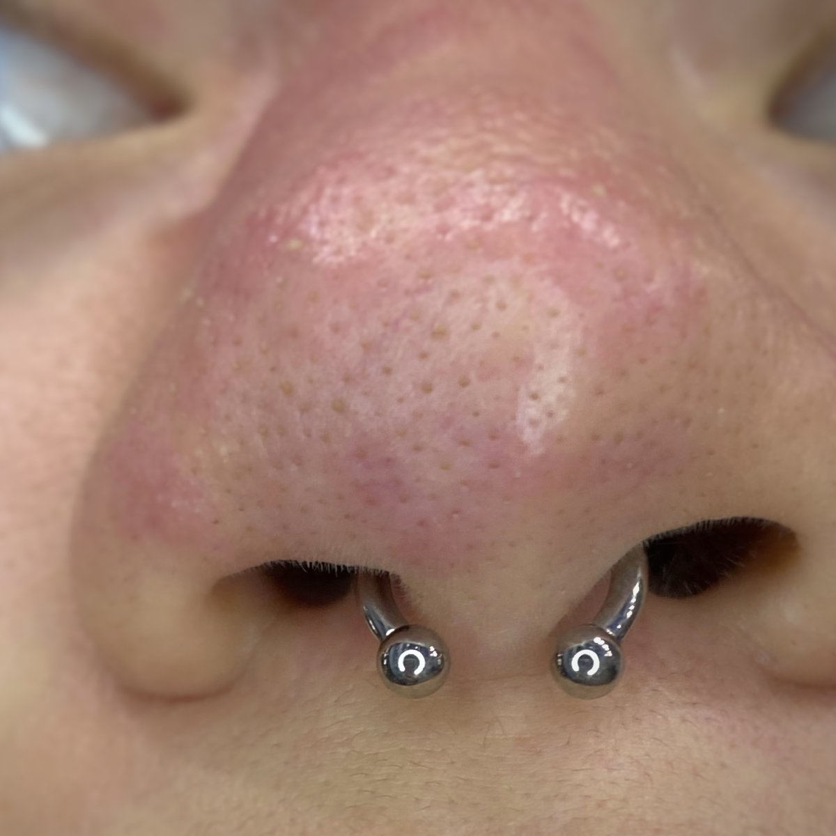 ECWJAX's tweet photo. Fresh septum piercing performed by Nana Shakti. Link in bio to book your piercing appointment at ECW Jax Beach location. #ECWJax #NanaPiercer #SeptumPiercing #Anatometal #Septum #BodyPiercing #LegitBodyPiercing #ProfessionalBodyPiercing #NosePiercing #JacksonvillePiercing https://t.co/kP9BMws4QY