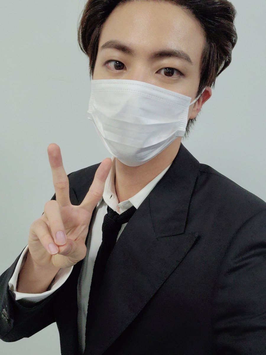 "In the posted picture, Jin wore a mask but was still able to show his unwavering visuals. Wearing a suit &amp; doing a V pose, Jin showed off his cuteness and coolness at the same time." #진 #JIN