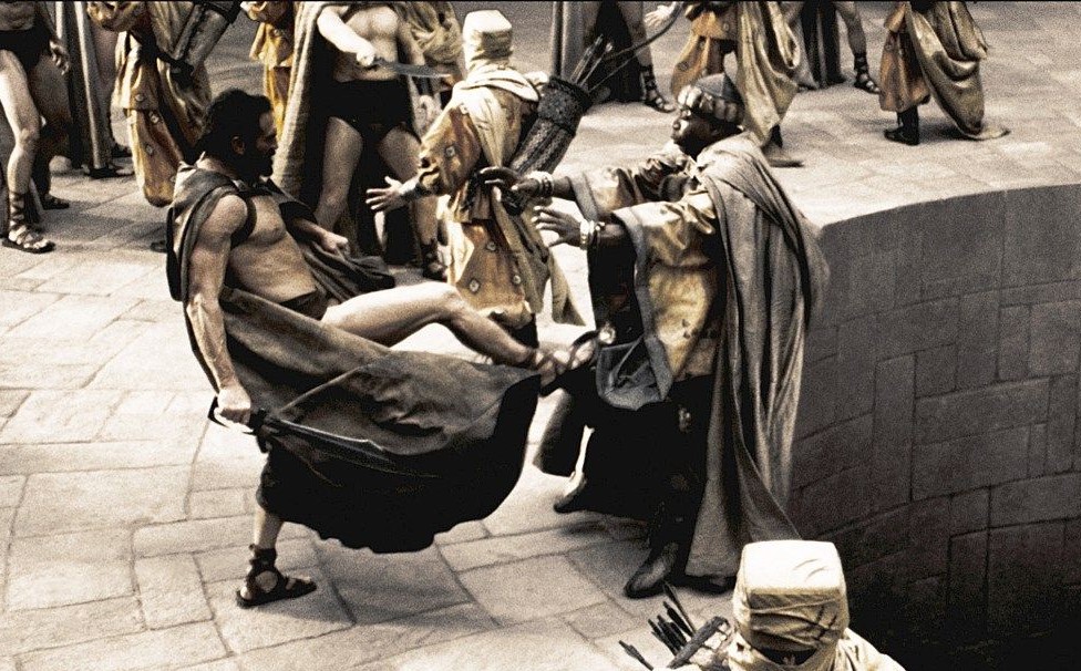 SteadyStudios's tweet photo. @CDCubed As a fellow translator, let me say that anyone giving flack or asking "questions" to a translator in regards to decision making is akin to Leonidas kicking this poor guy for just doing his job. Besides, we wouldn't be able to say anything even if we wanted to (NDA). https://t.co/Vn1ByZgdQk