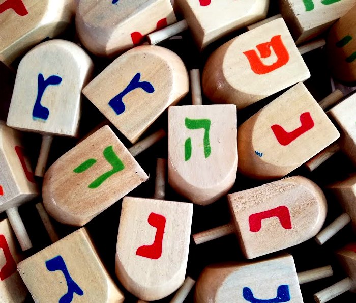 Another venerated tradition is a game children often play with a dreidel, a four-sided spinner that contains letters of the Hebrew alphabet. The letters are nun, gimmel, hey, and shin, an acronym for “nes gadol hayah sham,” which means “a great miracle happened there.”