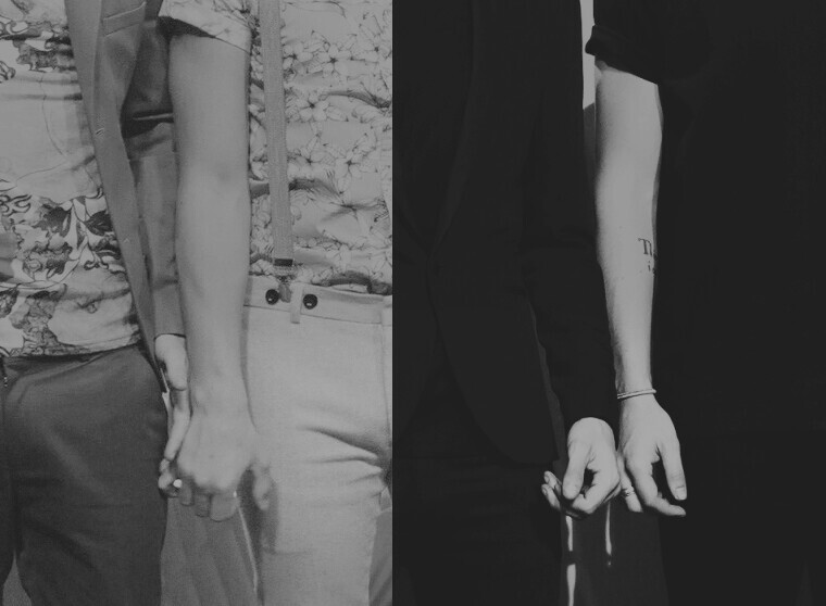 holding hands behind their backs...