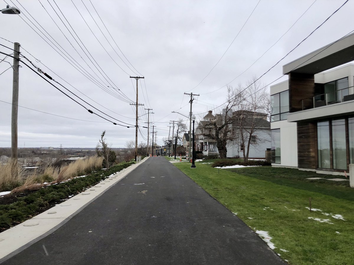 No, this isn’t just a regular repaved road with cars soon zipping by again. This is one of the last stages of the Towpath Trail, which has transformed this once car-dominated street into a car-free pedestrian and cyclist trail, along with the brand new Camp Cleveland park. (3/4)