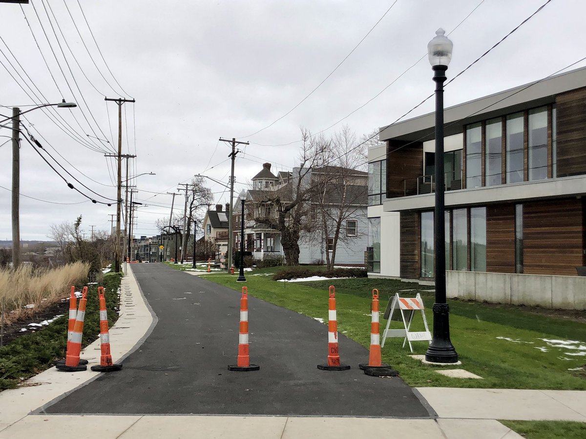 No, this isn’t just a regular repaved road with cars soon zipping by again. This is one of the last stages of the Towpath Trail, which has transformed this once car-dominated street into a car-free pedestrian and cyclist trail, along with the brand new Camp Cleveland park. (3/4)