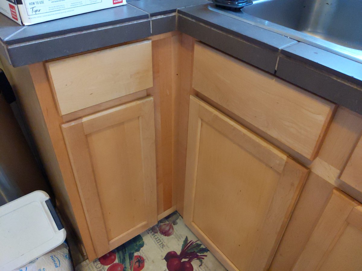 The skinny door cabinet is my dry goods/deep storage. It's dry, cool, and dark. And also large enough to fit an adult human inside if they can get in the door...