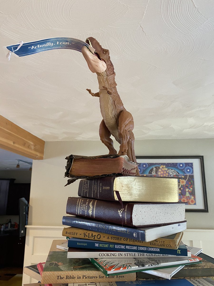 The annual book tree is up! Always with a heavy Crim-literature presence and this year topped off with a T-Rex 🦖