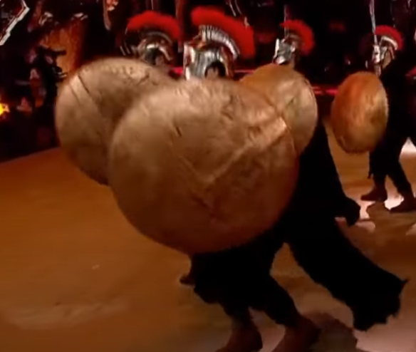 in this case, tbz could be persia and skz could be greece, seen in skz’s use of props and set design. tbz also used a sword as their ‘weapon’ in the statue backdrop while skz used a shield which could mean that tbz are invading their space and trying to take from them.