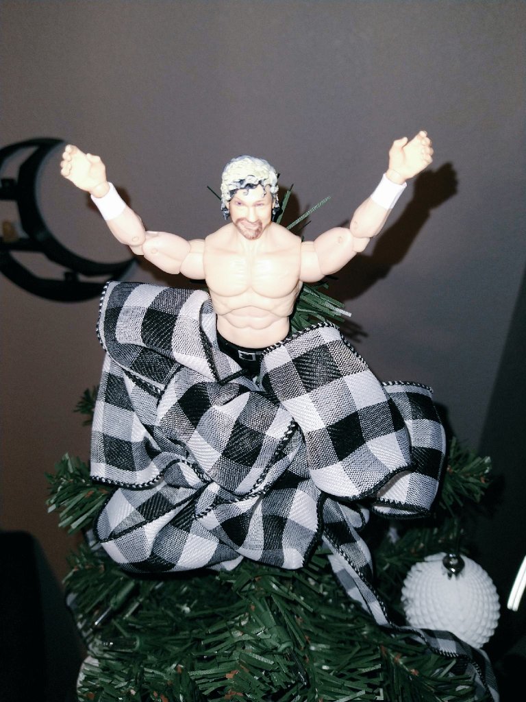We decided this atrocious misprint of a @KennyOmegamanX by @Ringsidecollec and @WickedCoolToys should top our 2020 tree as the perfect representation of our year. I implore you to take a closer look. #AEW #aewunrivaled #ringsidecollectibles #exclusive #illhappilytakeareplacement