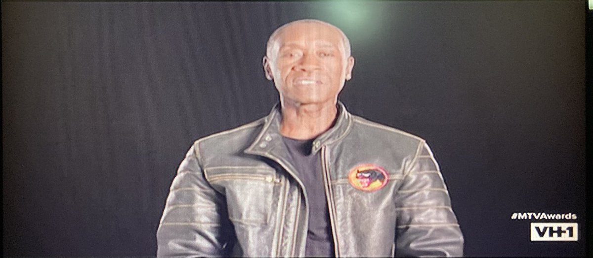 Don Cheade and Robert Downey Jr. in very simple black backgrounds can’t attend also. Note Cheade’s black panther patch