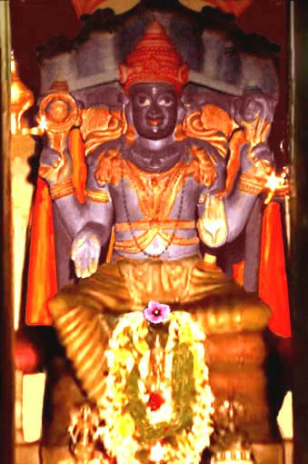 lake and connected by a small bridge.Here, Sri Anantha Padbhanabha is seated on the divine serpent Anantha, while in Sri Padmanabha Swamy Temple Thiruvananthapuram, the Swamy is reclining on Anantha.