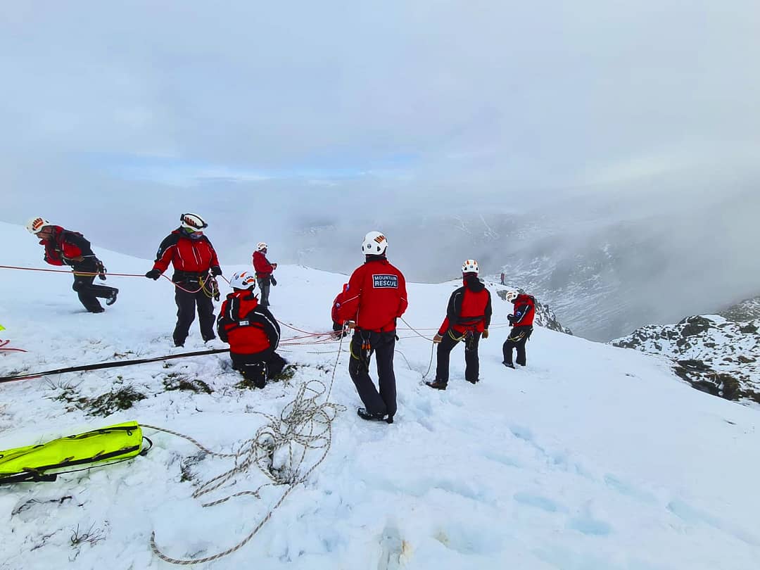 Team Training

The Team had a high level exercise carrying large amounts of rope and equipment, to the top of Bleawater downfall, high above.
The Team created anchors by driving steel stakes through the snow into the ground and lowered Team members over 250 metres down the crags.