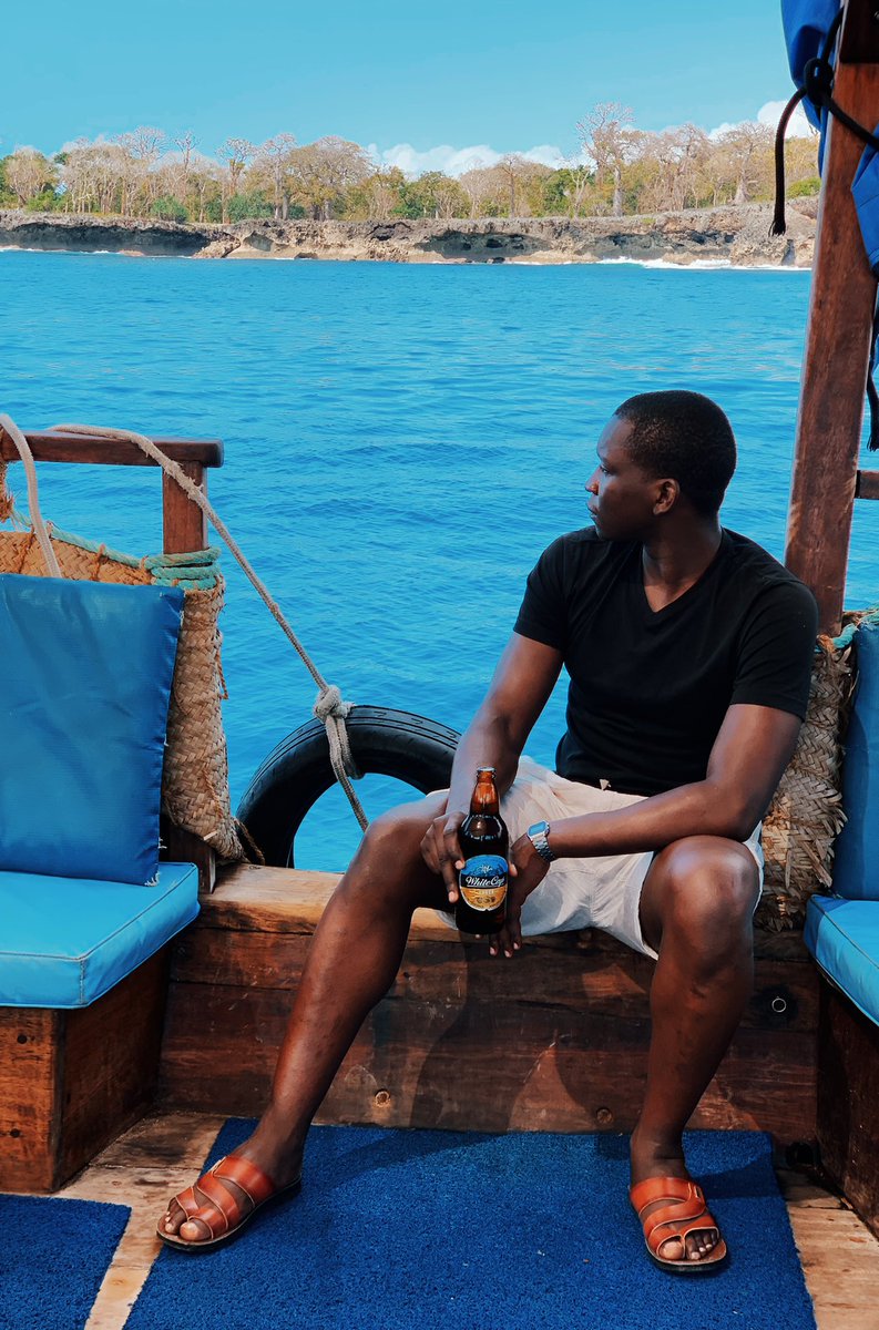 theMagunga's tweet photo. Calm blue waters all around you, dhow swaying this way and that way, and a cold bottle of perfection going down your throat like a gentle waterfall. 

A mood. 

#ALegacyOfPerfection
#Paidpartnershipwithdiageo https://t.co/0YpUxT0Ue5