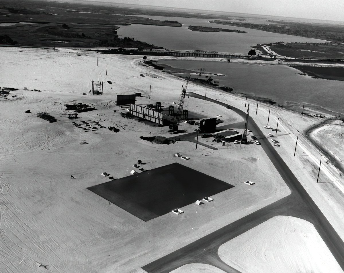 The first MLP began construction in July of 1963. The first image here is from late 1963 shows the construction areas just north of the VAB site for MLPs 1 & 2. The second image is a closer look at one of the MLPs in early 1964.