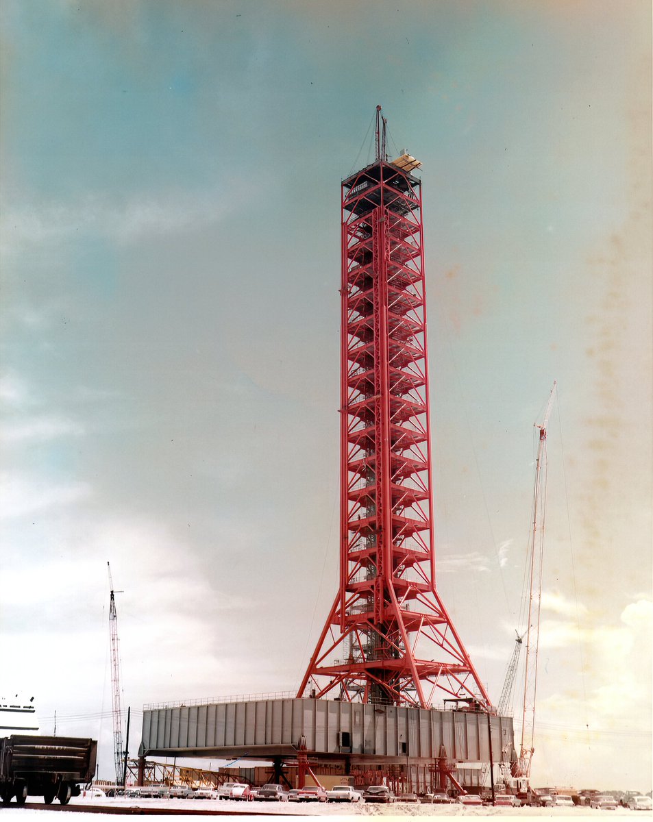 The umbilical tower would stand 121.5m (without crane) above the launch platform. These images from July and August 1964. (Check out the cool landscape of all the other launch pads and facilities in the first image!)