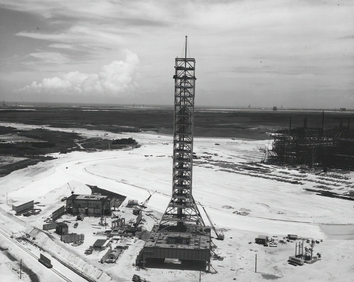 The umbilical tower would stand 121.5m (without crane) above the launch platform. These images from July and August 1964. (Check out the cool landscape of all the other launch pads and facilities in the first image!)