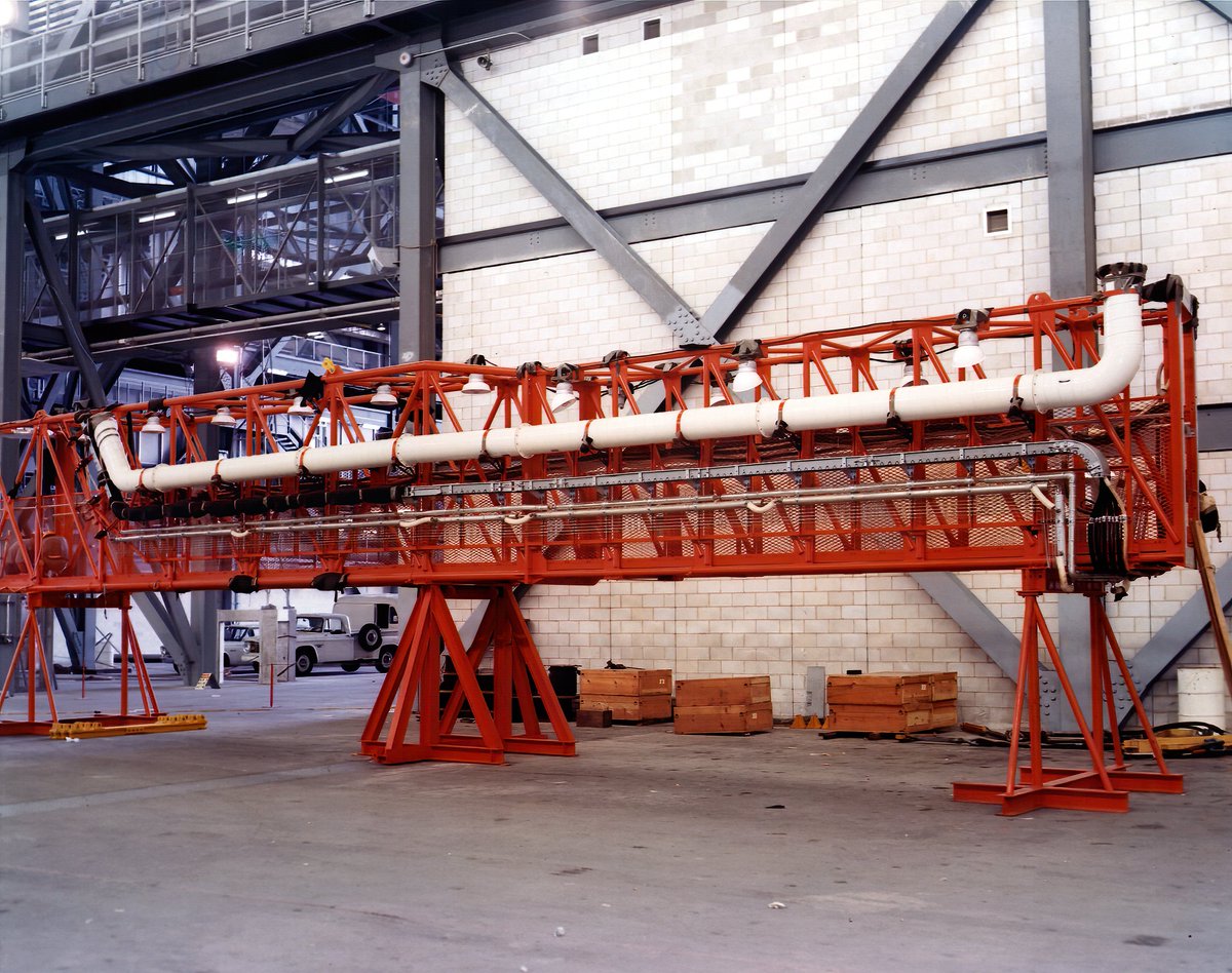 Service (swing) arm 9 in the transfer aisle of the VAB before and after receiving the White Room. This arm would then be attached to MLP 1.Images 23 May 1966.