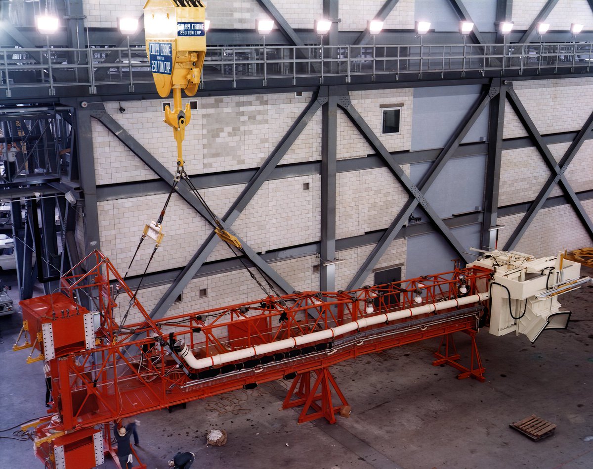 Service (swing) arm 9 in the transfer aisle of the VAB before and after receiving the White Room. This arm would then be attached to MLP 1.Images 23 May 1966.