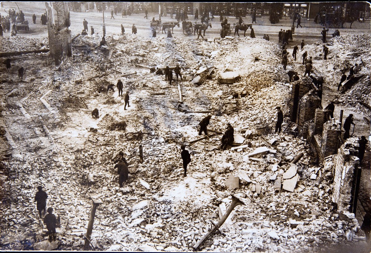 By 8.00am on Sunday 12 December, due to heroic work of many, Captain Hutson was able to report that most of the fires in the city centre were under control. That morning, a broken-hearted Donal O'Callaghan surveyed the damage, accompanied by Liam de Roiste. Pic from  @CorkPMuseum.