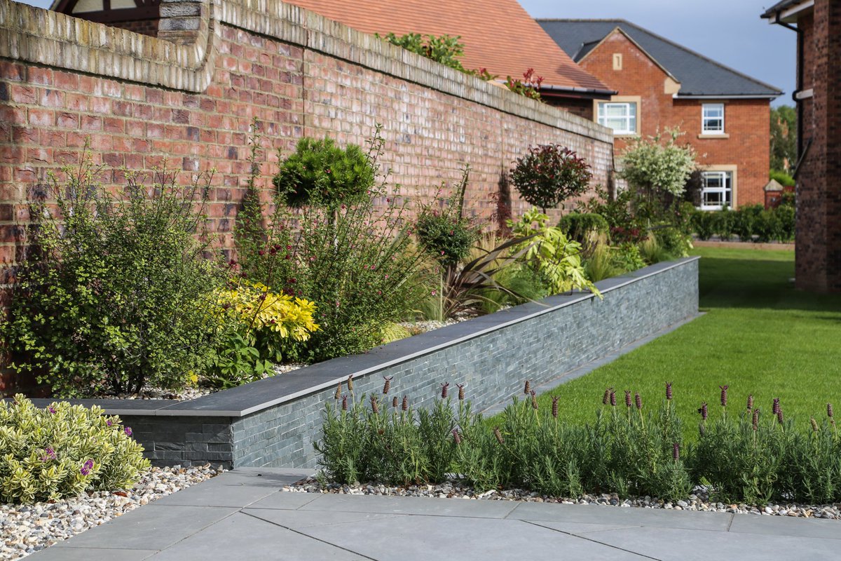 Mixing modern with traditional walling and planting #gardens #gardenwalling