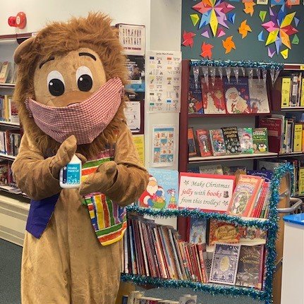 cambslib's tweet photo. Brian the Linton Bookfest Lion dropped by Linton Library today to help prepare our selection of Christmas books. Of course he sanitised his paws first! #Cambslib #LintonBookfest https://t.co/hvCKal0vyb