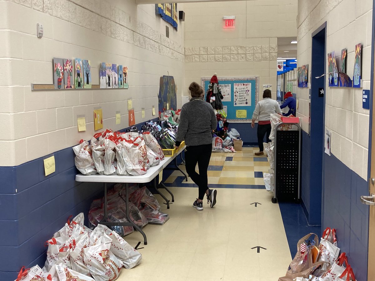KenjiMatsudo's tweet photo. Shout out to our Madeira teachers and staff working hard today to pivot to remote learning.  Bags loaded and computers deployed at MES.  I’m sure this is like being at the North Pole.  Go Madeira! https://t.co/QI6nSZHc0h