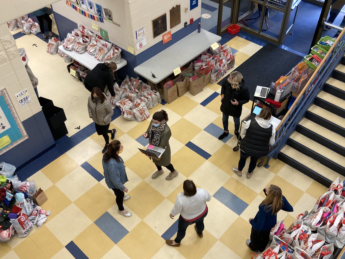 KenjiMatsudo's tweet photo. Shout out to our Madeira teachers and staff working hard today to pivot to remote learning.  Bags loaded and computers deployed at MES.  I’m sure this is like being at the North Pole.  Go Madeira! https://t.co/QI6nSZHc0h