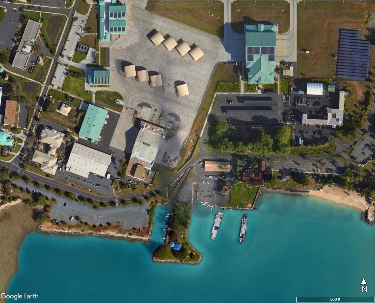 ...that the USAF operates delicate F-22 stealth fighters out of open-air shelters a stone's throw from the beach in Hawaii (seen here in imagery of the Hickam airfield)...