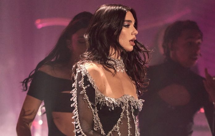TrendsNash's tweet photo. @DUALIPA certainly set the bar high with her Studio 2054 livestream that drew over 5 million views. The pop icon sparkles in more ways than one, particularly in her glittery wardrobe. https://t.co/A1zoUNXdbh