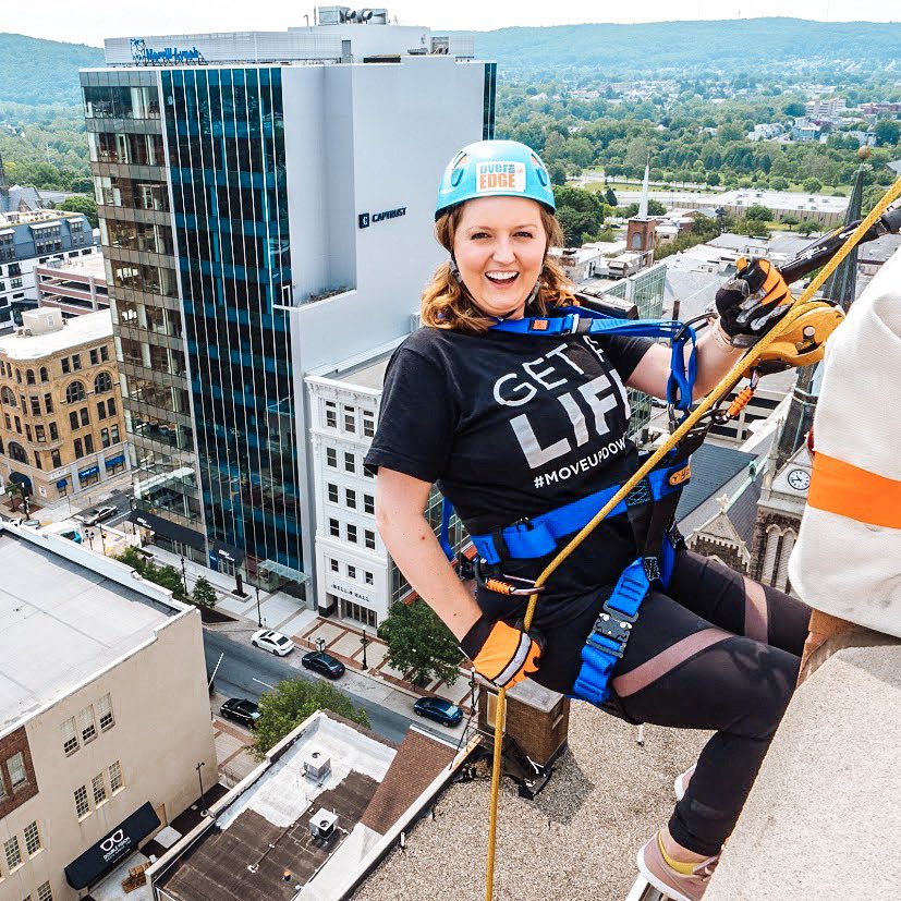 BlueHenMeagan14's tweet photo. So what have I been up to? I work in residential leasing for a real estate developer in PA and sometimes I rappel off buildings for charity! https://t.co/XoFFR8tg0t