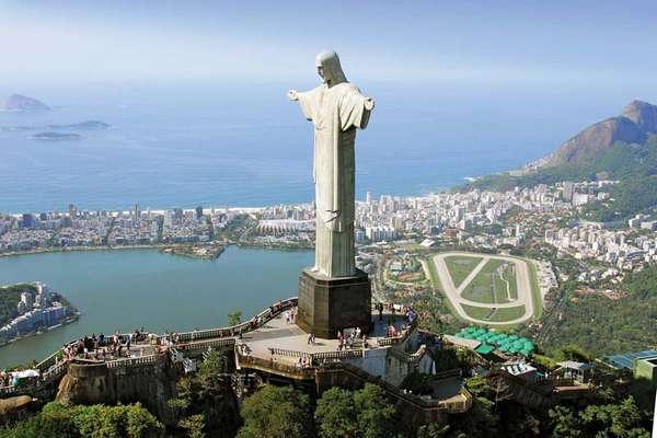 Christ the Redeemer, Rio Brazil.This is 98 feet tall. It's base is also 26 feet tall . Fun fact? Jesus has been struck by lightning a lot of times that his thumb has blew off