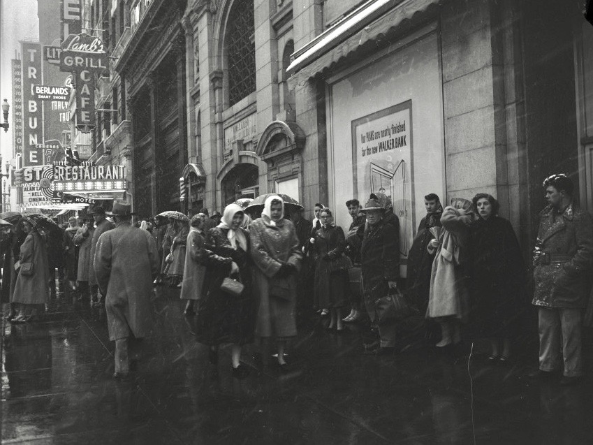 A vibrant Main Street with a whole lot of people at all times of day