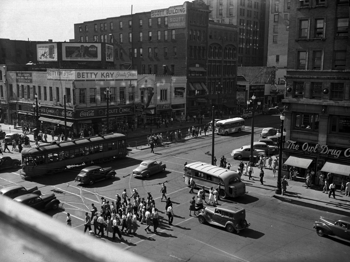 A vibrant Main Street with a whole lot of people at all times of day