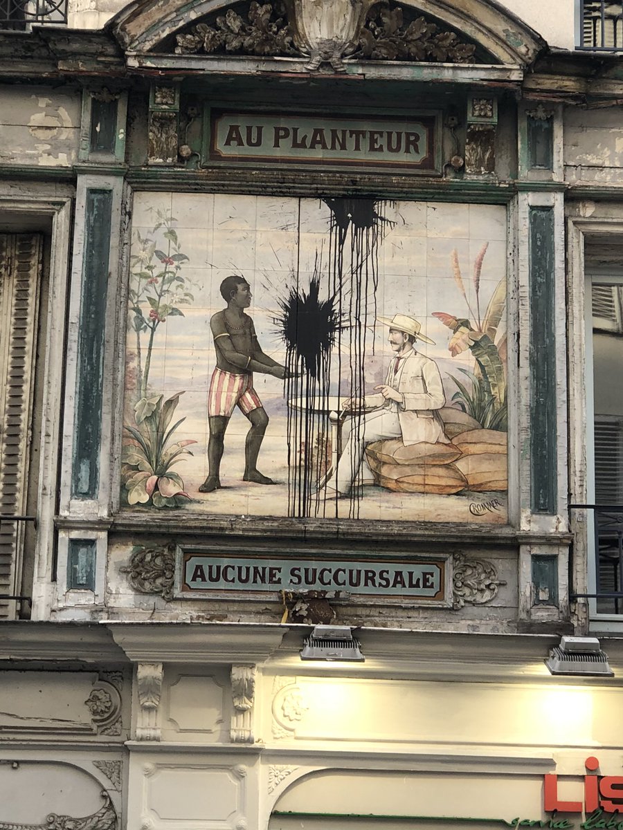 sjackson629's tweet photo. Shockingly racist fresco on rue montorgueil. Installed in 1890 to advertise exotic goods from the colonies. https://t.co/FxtTEsXhf6