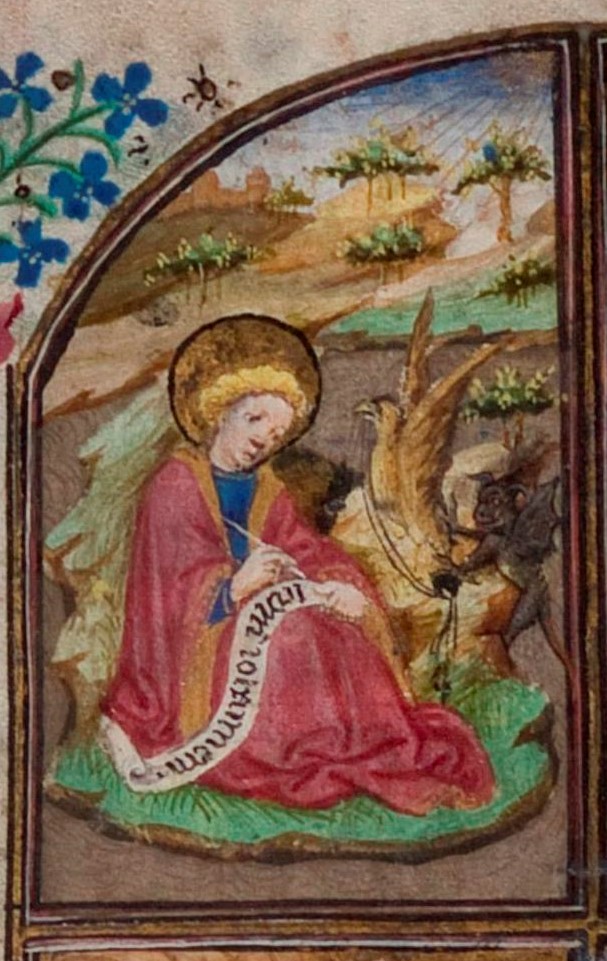 St John with his eagle is shown in front of a landscape scene, he sits on the Island of Patmos writing the Apocalypse. See the eagle holding the inkpot in his beak and the cheeky impish devil spilling the ink?  #BookofHours