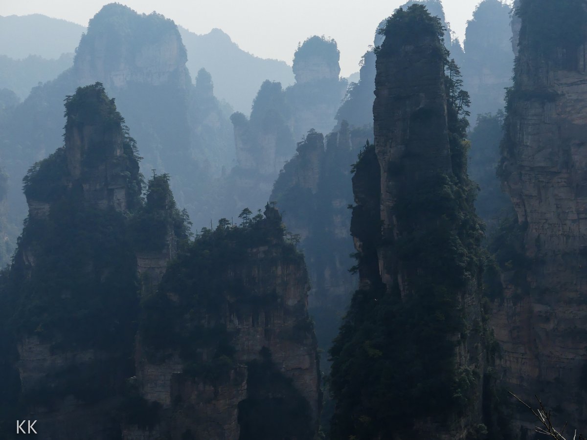 The impossible landscape of Zhangjiajie National Forest Park in China. Pillars of rock rocketing up from deep rugged canyons create an impenetrable land that looks like they might be floating on another planet. Photo from my book #VanishingAsia #Zhangjiajie #China