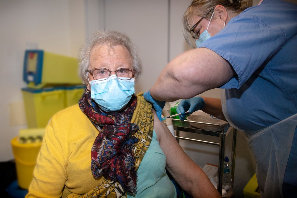 SFHFT's tweet photo. Former NHS worker, Ann Allen, was the first patient in the North Nottinghamshire area to get the Covid-19 vaccination today as we began vaccinating patients against coronavirus at our hospital hub, at King's Mill Hospital - https://t.co/hFMs9UP3oY https://t.co/mNszboByPO
